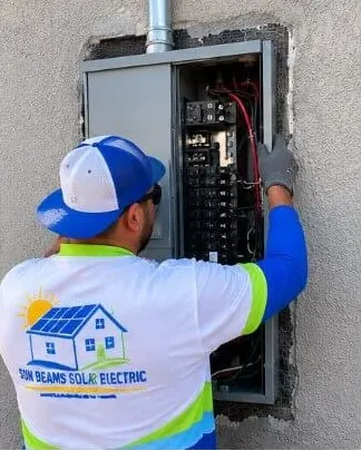 Electrician upgrading a main service panel