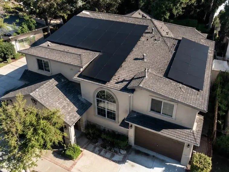 All-black solar panels on a two-story home